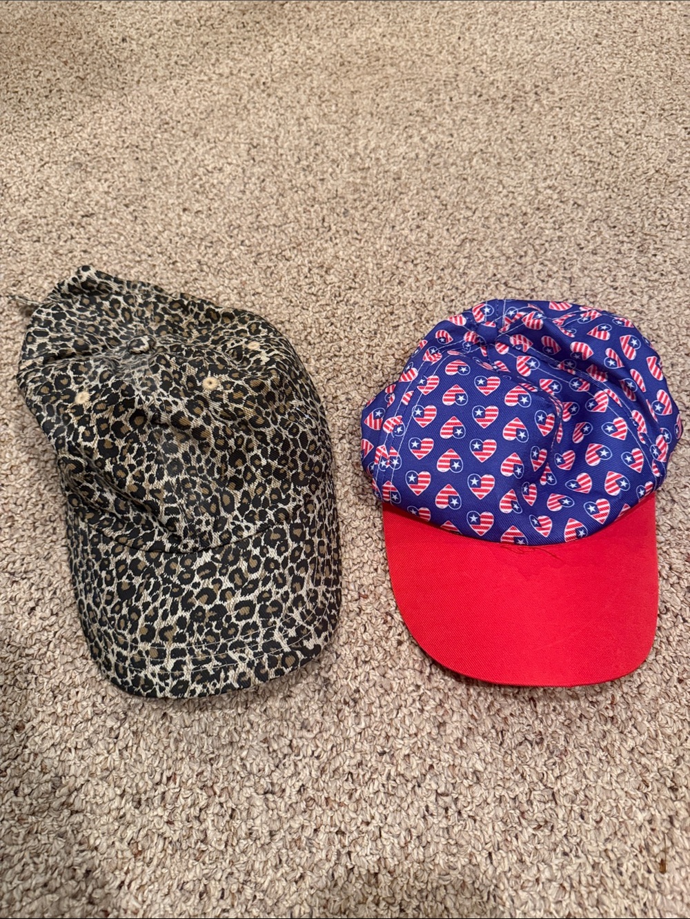 2 baseball type hats. Leopard Print + Patriotic Heart Cap Duo